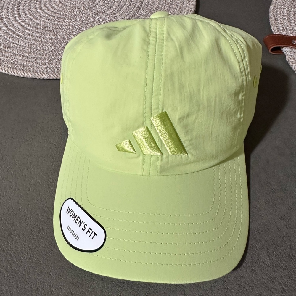Adidas lime green baseball hat.